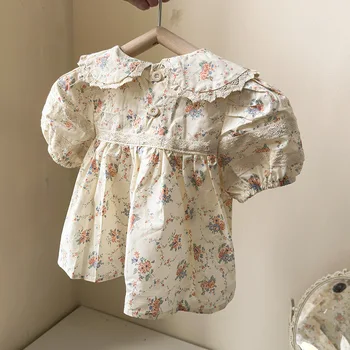 Детская одежда Хлопковая рубашка с кукольным воротником 2023 Летняя новинка Модная детская рубашка с коротким рукавом в цветочек для девочек Модный детский топ